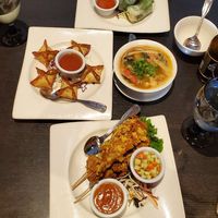 Cream cheese wontons, spring rolls, soup, soy chiken satay at Veganic Thai Cafe in San Diego