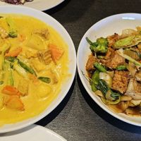 Yellow curry with white rice and drunken noodles with veggies and fried tofu at Veganic Thai Cafe in San Diego