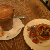 Caffe Latte with a caramel tarlet. Perfect. The coffee is great and the nutty tartlet is filled with a delicious caramel sauce. at Cafe Dei Campi in Montreal