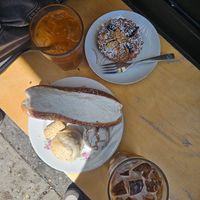 The glacé, latte glacé, tarte à la prune, biscuits sablé à l’amande, biscuit au citron, petit sablé et truc délicieux à la crème et à l’orange. at Cafe Dei Campi in Montreal