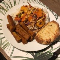 Red thai curry, chickpea fries and naan at vanVeg in Haarlem