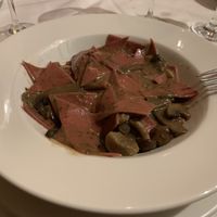 fresh vegan pasta irregularly cut infused with beetroot juice bathed in mushroom sauce at Est! Est! Est! in Belo Horizonte