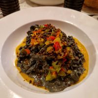 Black garlic and yellow cherry tomato sauce with peppers and a black olive crumble! at Pasta Factory in Manchester
