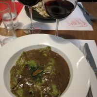 Vegan mushroom ravioli with truffle sauce and vegan red wine at Pasta Factory in Manchester