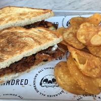 Kindred BBQ jackfruit sandwich with homemade potato chips at Kindred in San Diego