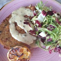 Soul Quest - pounded gardein schnitzel, lemon beurre blanc, chicory salad, grilled lemon at Kindred in San Diego