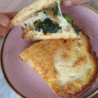 Mind Melt - sourdough grilled cheese, bechamel, kale, French onions, apples, spicy (rice-based) honey at Kindred in San Diego