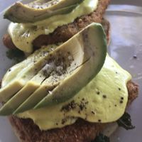 Tofu Benedict w grilled tomato on side  at Kindred in San Diego