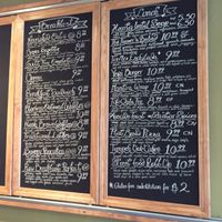 Restaurant Menu on their wall at Wild Rice Vegan Cafe in Watertown