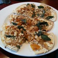 Flatbread pizza w/ butternut squash, sage leaf, walnuts & vegan cheese at Wild Rice Vegan Cafe in Watertown
