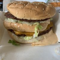 Big Zac Burger (two sizzled ‘beefy’ patties, American ’cheese’, shredded lettuce, diced raw onions, pickles, and a special sauce at Plant Power Fast Food - Ocean Beach in San Diego