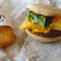 Sausage and egg muffin with hash brown at Plant Power Fast Food - Ocean Beach in San Diego