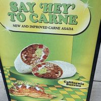 Sign outside for comparison to the real thing   at Plant Power Fast Food - Ocean Beach in San Diego