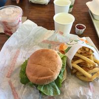 Crispy chicken sandwich, fries and strawberry milkshake. Very American yet very vegan.  at Plant Power Fast Food - Ocean Beach in San Diego