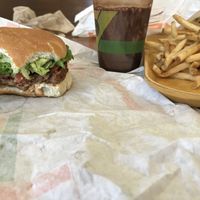 The Holy Guacamole Burger with a chocolate shake and fries at Plant Power Fast Food - Ocean Beach in San Diego