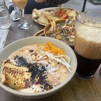Shoyu Ramen with tofu, beer poured Clinton style, Vegan Poutine, Mushroom Ravioli  at Nourish Bistro in Banff