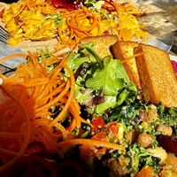 Nourishment Bowl with added Tofu and insanely good vegan nachos. 💯 recommend   at Nourish Bistro in Banff