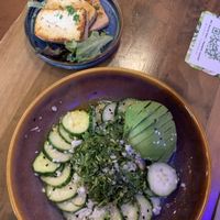 Cucumber salad with avocado and tofu on the sidee  at Nourish Bistro in Banff