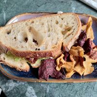 Sourdough sandwich with vegan feta, avocado and sun-dried tomatoes at Qoozies in Chesterfield
