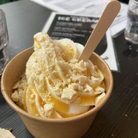 Vegan soft scoop with passion fruit coulis and white chocolate!    at The Bagelry  in Liverpool