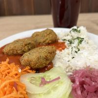 Falafel, rice, tomato sauce and salads, and fresh kompot  at Bar Górski in Zakopane