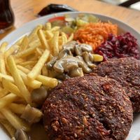 Beetroot patties, fries, mushroom sauce and salads  at Bar Górski in Zakopane