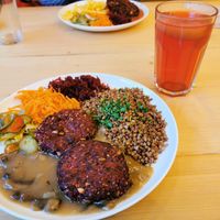 Beetroot cutlets, kasza gryczana, mushroom sauce and salads with apple juice at Bar Górski in Zakopane