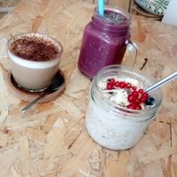 Porridge with fresh fruit, cappuccino w almond milk & acai smoothie at Paper Plane in Nice