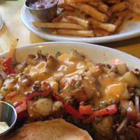 Vegan cheese fries and chorizo scramble with a bagel 😍 at Pick Me Up Cafe in Chicago