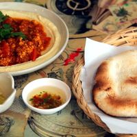 One of the many different hummus portions, pita and some spices.  at Gallery House of Hummus in Koh Phangan