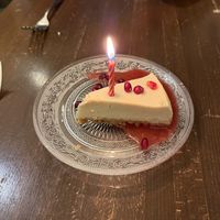 Birthday Cheesecake with Pomegranate Sauce  at Veg Cafe in Sacramento