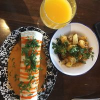 Breakfast burrito, hash browns and mimosa  at Veg Cafe in Sacramento