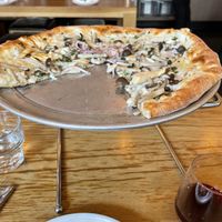 Pizza con fungi with vegan cheese.  Chianti in lower rh corner.  at Delarosa - Yerba Buena in San Francisco