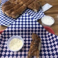 Garlic bread with vegan ranch and vegan Parmesan   at Pizza Classics in San Antonio