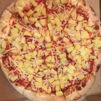 Vegan cheese & pineapple pizza  at Pizza Classics in San Antonio