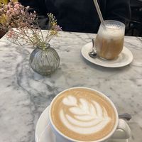an iced caramel macchiato and an oat milk latte at Papu Cafe in Helsinki
