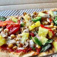 Vegan pizza! ⭐️ Lots of veggies, vegan cheese, spicy chickpeas, vegan beef and pineapple   at IAD - &pizza - CC in Dulles