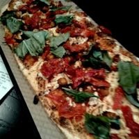 spicy chickpea, wild grain crust, spicy sauce, basil, sun-dried tomatoes  at IAD - &pizza - CC in Dulles