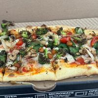 Pizza with vegan cheese and veggies  at IAD - &pizza - CC in Dulles