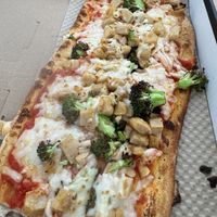 Pizza with regular sauce, vegan cheese, vegan chicken and broccoli  at IAD - &pizza - CC in Dulles