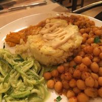 Plato del día... Meal of the day... Baked chickpeas, raw zucchini pesro, millet and vegetable cake, carrot paté... Yummy at Gustu Bilbao in Bilbao