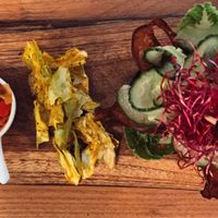 raw-vegan ";burger"; made with shii-take mushrooms, walnuts, sundried tomatoes & flax seed, served on a portobello mushroom with a side of cabbage chips & kimchi! at Zest for Life in Amsterdam