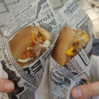 Hotdogs, one with carrot pickle and Chinese cabbage salad, the other with pear salad and beetroot salad at Velo Vege Food Bike in Toulouse