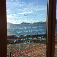The menu is written on the window so you can see the stunning view at the same time! at Knoydart Pottery and Tearoom in Knoydart