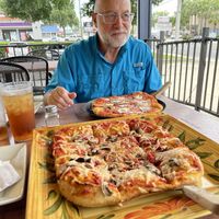Mine is vegan -his is not. 😃  at Blue Highway Pizza in Ocala