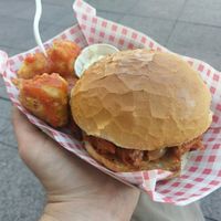 BBQ pulled jackfruit burger with beer-battered cauliflower bites in hot sauce at Bia Kitchen Vegan Diner - Food Stall in Norwich