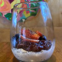 Cashew cream with berry compote and fresh blueberries and strawberries   at Curcuma in El Chalten