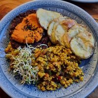 The burger comes with fried rosemary potatoes at Curcuma in El Chalten