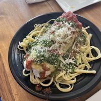 A “burrito” of meatballs and kale and cherry tomatoes over pasta with tomato sauce . Wow.  at Root in Lancaster
