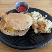 egg, cheese, and sausage between pancakes and served with hash browns at Root in Lancaster